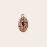 14k Yellow Gold Oval Charm with Prong set Ruby Cabechon and Princess Cut Iolite