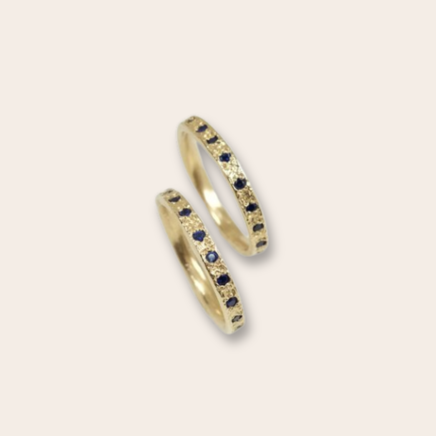 14k YG and round blue sapphire eternity band 